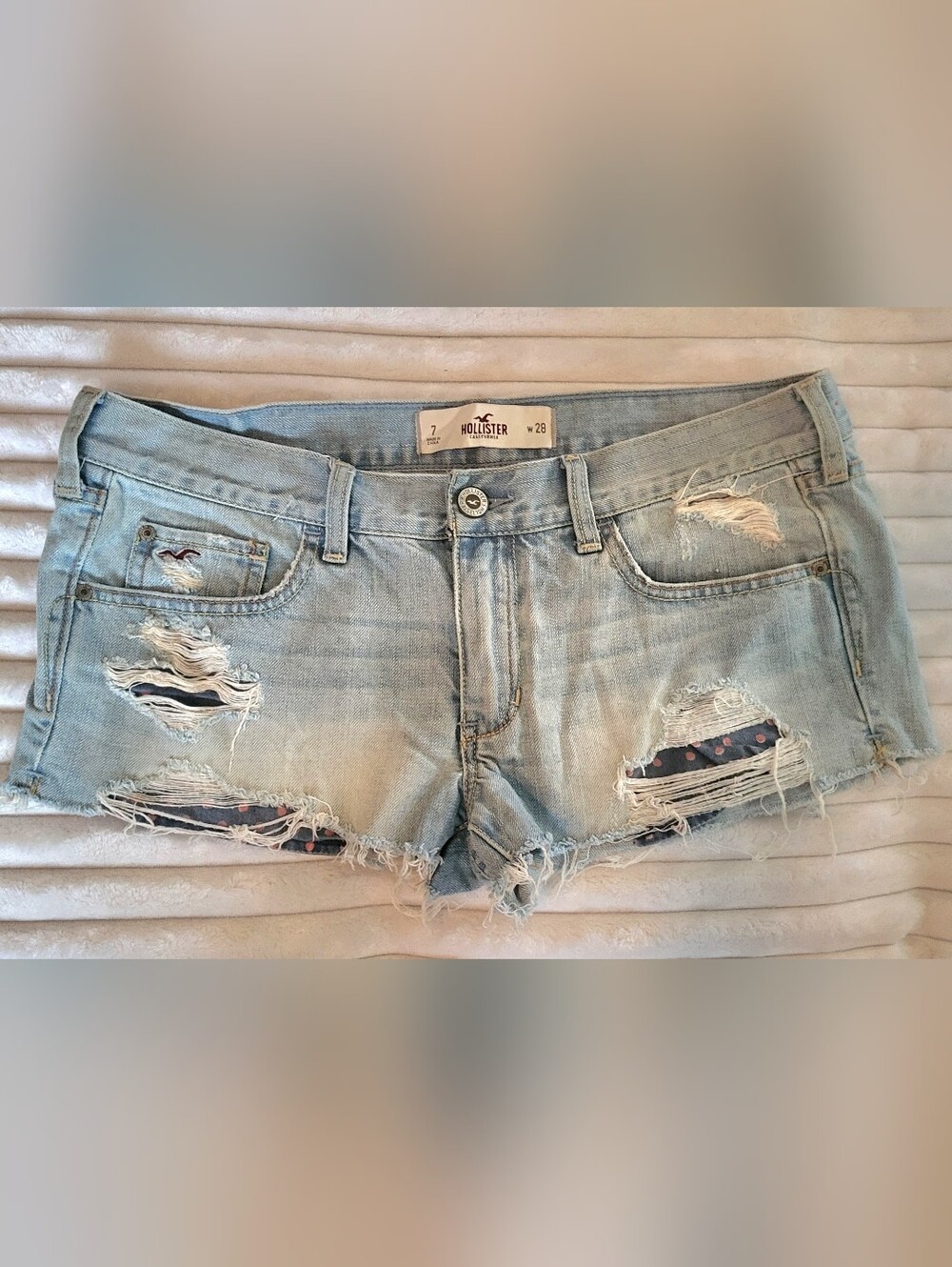 vintage Hollister low-rise, heavily distressed denim micro-shorts
